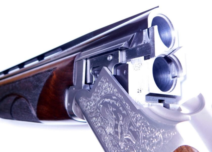 O/U shotgun sold at auction